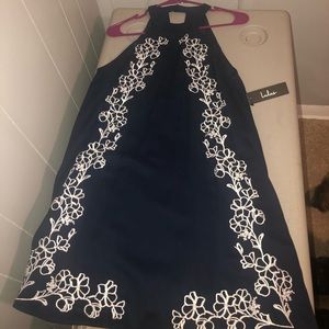Navy halter dress with white floral design
